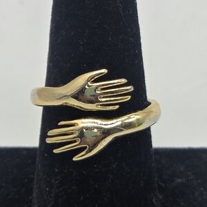 finger hugging hands ring gold tone costume some wear adjustable sz 7.5